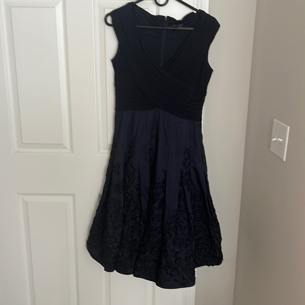 Navy cocktail dress with flower detail